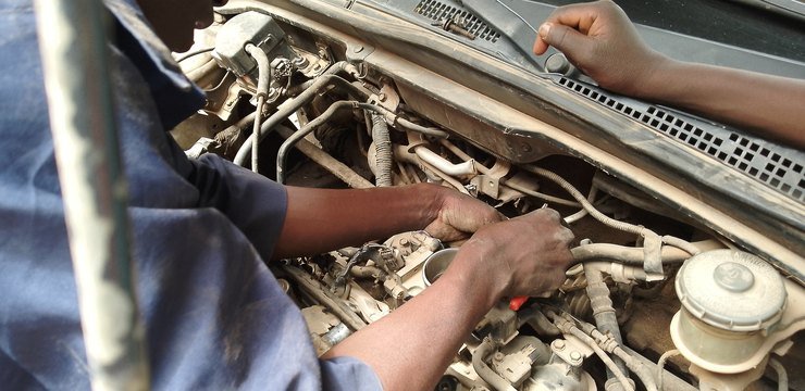 Mechanics working on a car