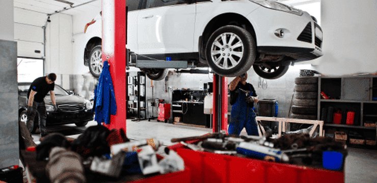 A car raised on a workshop lift